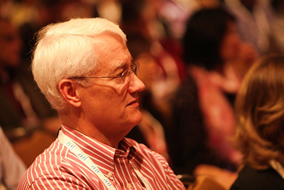 man in auditorium learning