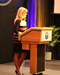 woman speaking at podium