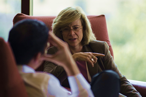 woman sitting on chair having a discussion